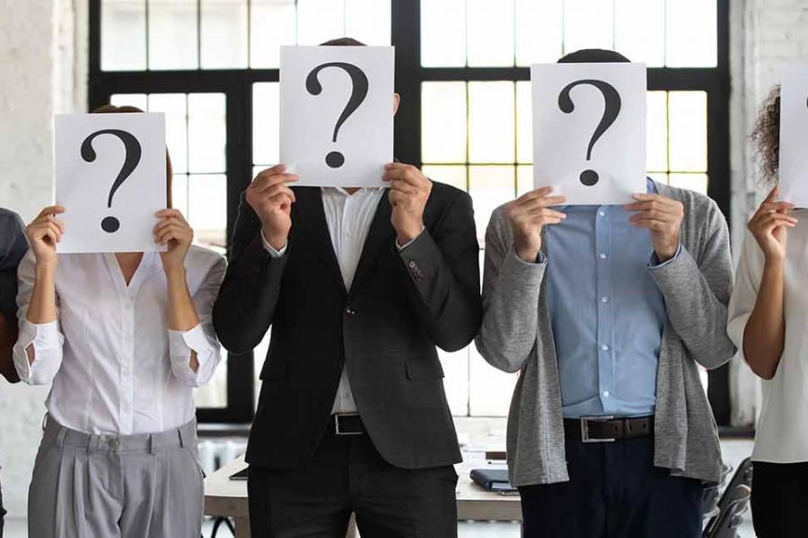 Diverse candidates are holding the paper with a big question mark.