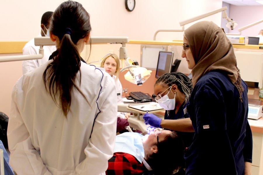 Dentistry students in a dentistry lab.