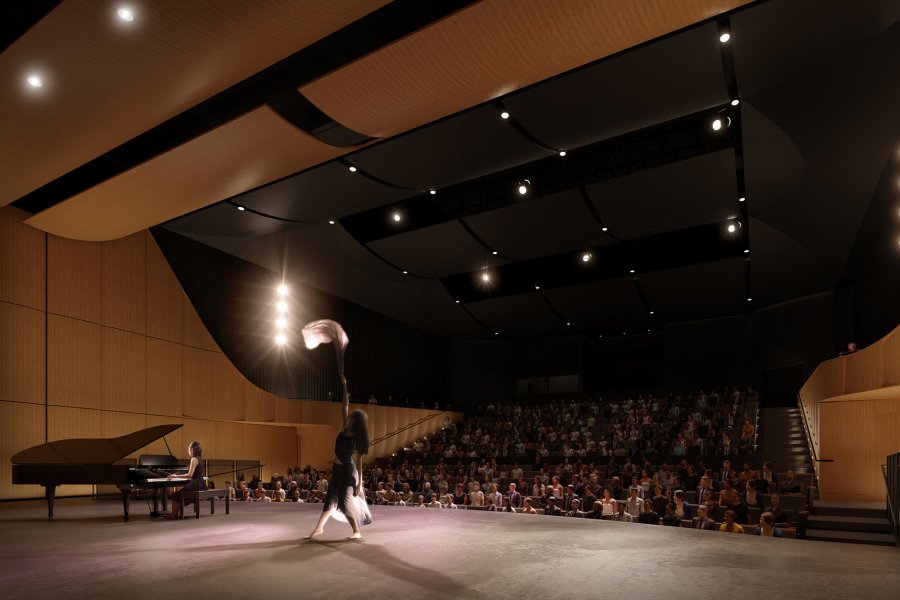 Interior view of the Desautels Concert Hall, showing a solo performer on the small stage configuration