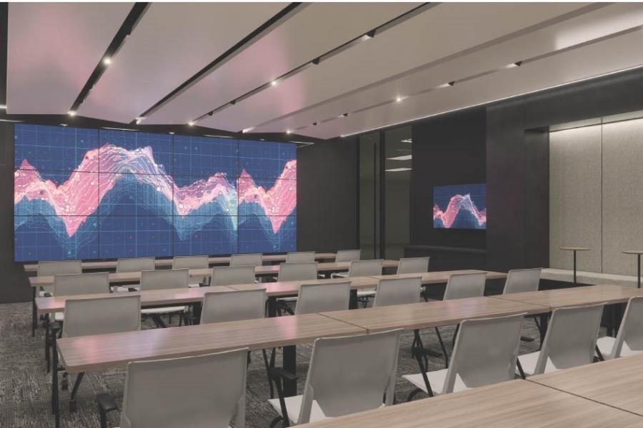 A rendering of a classroom with data visualization wall