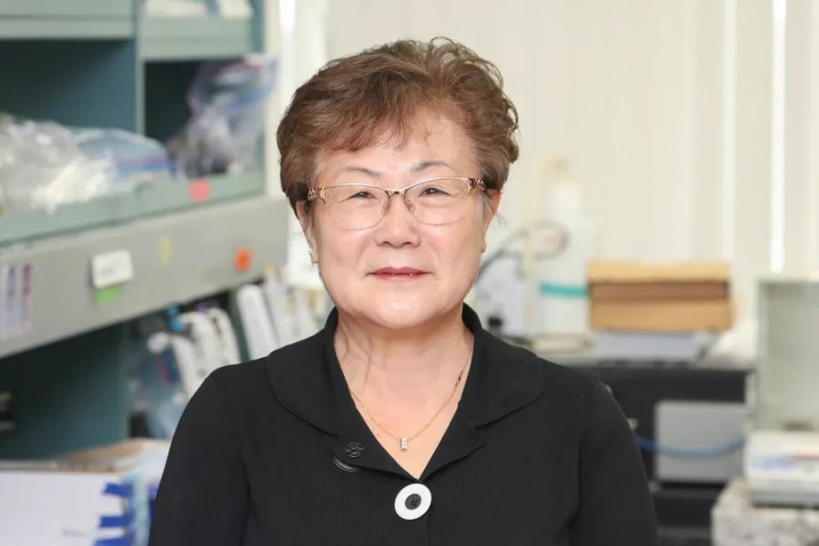 Dr. Miyoung Suh smiles facing head on.