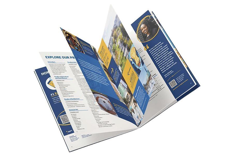 An image of UM's printed viewbook with pages fanned out