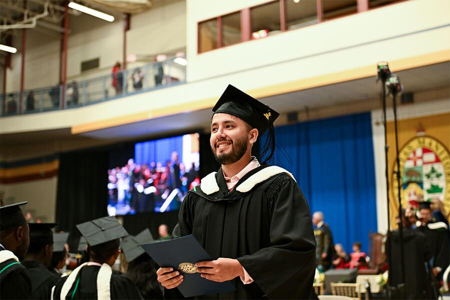 Image of student wearing convocation robes at the graduation ceremony.