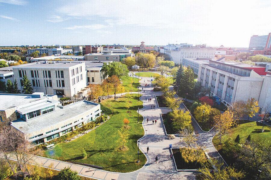 Image of various UM buildings and pedway in fall.