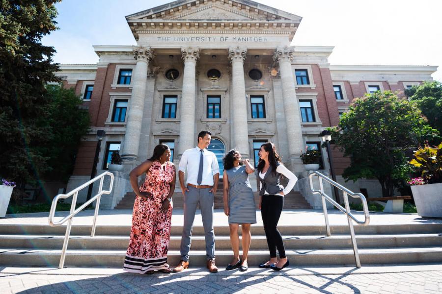 international students standing in front of admin building