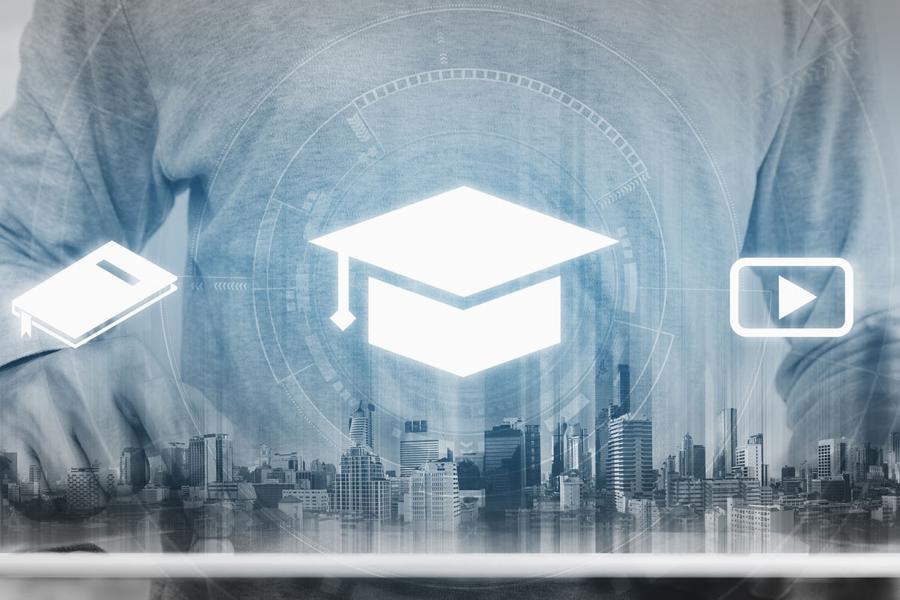 The man is using tablet for the online studying.