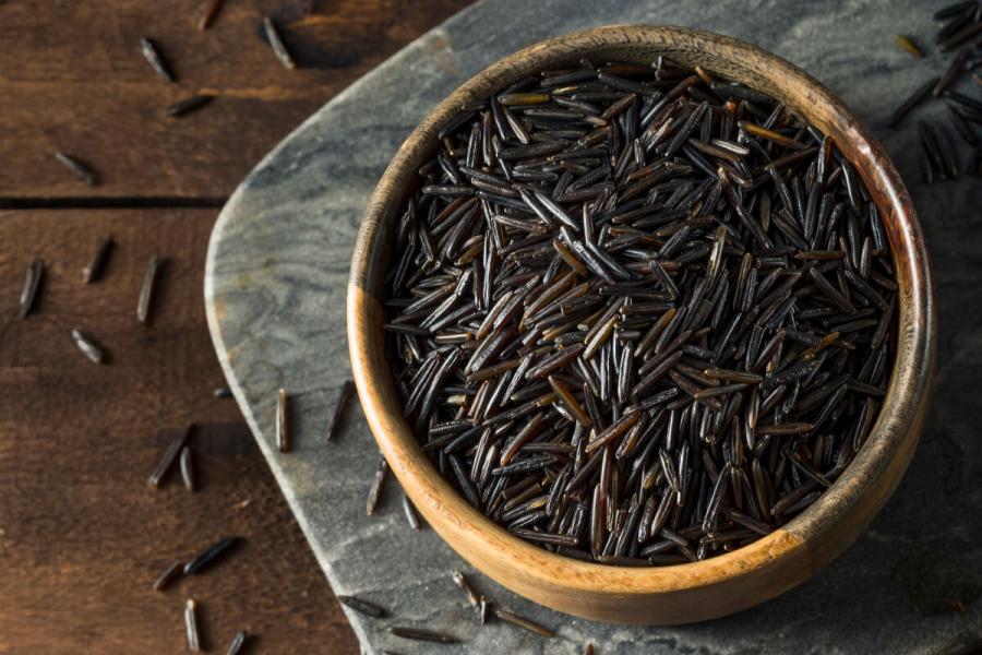 Wild rice in a brown bowl.