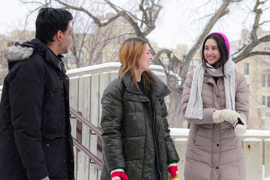Students walking outside and chatting in winter