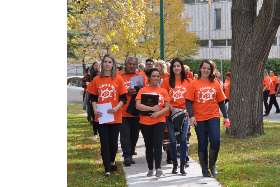 "University of Manitoba nursing department leading a Truth and Reconciliation Walk on campus, with participants wearing orange 'Every Child Matters' shirts.