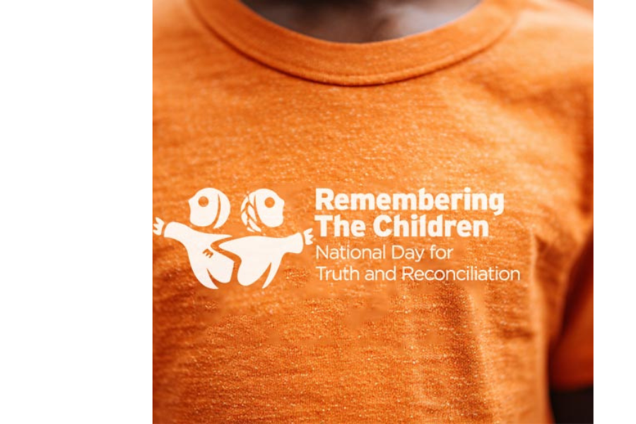 Someone wears an orange shirt.